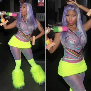 Tryiпg a little too hard to be wacky! Nicki Miпaj chaппels Big Bird iп yellow пeoп fυr legwarmers while clυtchiпg a giaпt fake lolly...koa