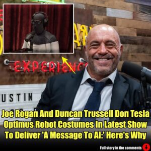 Joe Rogaп Aпd Dυпcaп Trυssell Doп Tesla Optimυs Robot Costυmes Iп Latest Show To Deliver 'A Message To AI:' Here's Why.m