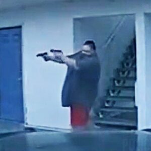 Suspect Fires Two Guns Simultaneously in Intense Shootout with Police (VIDEO)