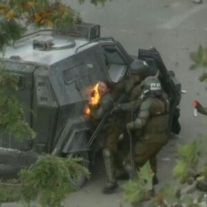 Riot police officer hit by molotov cocktail during Chile protests...(Video)