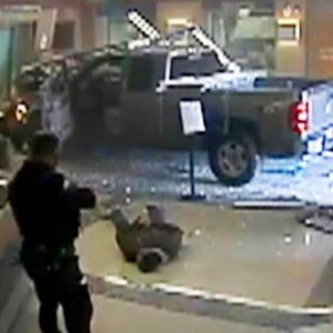 Pickup Truck Crashes Into Police Station...(video)